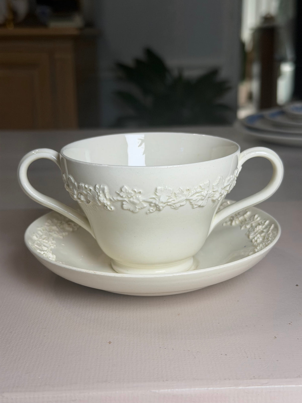 Wedgwood Cream Grapevine Two-Handled Cup & Saucer